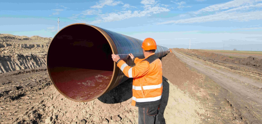 pipeline-workers-measuring-tube-length-construction-gas-oil-pipes